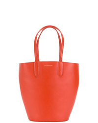 Оранжевая кожаная сумка-мешок от Alexander McQueen