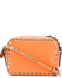 Оранжевая кожаная сумка через плечо от Valentino Garavani