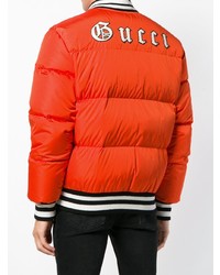 Мужская оранжевая куртка-пуховик от Gucci