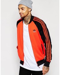 Мужская оранжевая куртка от adidas