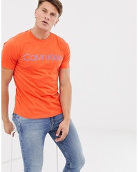 Мужская оранжевая футболка с круглым вырезом с принтом от Calvin Klein