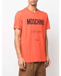 Мужская оранжевая футболка с круглым вырезом с принтом от Moschino