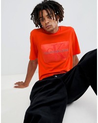 Мужская оранжевая футболка с круглым вырезом от Calvin Klein Jeans