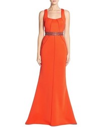 Оранжевое вечернее платье с украшением