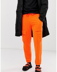 Оранжевые брюки карго от ASOS DESIGN