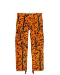 Оранжевые брюки карго от Carhartt WIP
