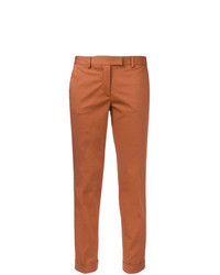 Оранжевые брюки чинос