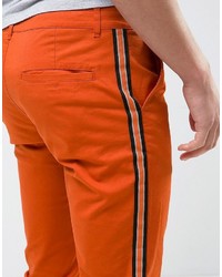 Оранжевые брюки чинос от Asos