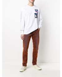 Мужские оранжевые джинсы с принтом тай-дай от Diesel