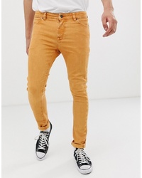 Мужские оранжевые зауженные джинсы от ASOS DESIGN