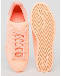 Мужские оранжевые кеды от adidas