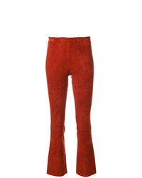 Оранжевые кожаные брюки-клеш
