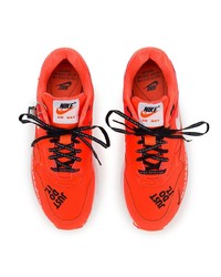 Женские оранжевые кожаные низкие кеды от Nike