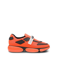 Женские оранжевые кроссовки от Prada