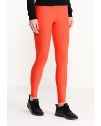 Оранжевые леггинсы от Nike