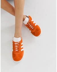 Женские оранжевые низкие кеды от adidas Originals