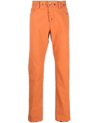 Оранжевые рваные джинсы