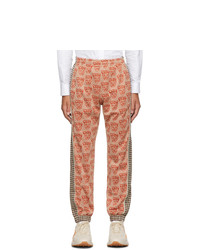 Мужские оранжевые спортивные штаны с принтом от Gucci