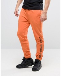 Мужские оранжевые спортивные штаны от Asos