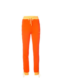 Женские оранжевые спортивные штаны от Fenty X Puma