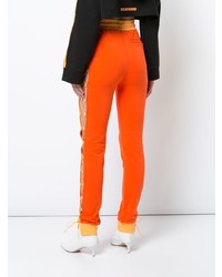Женские оранжевые спортивные штаны от Fenty X Puma