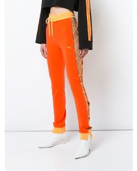 Женские оранжевые спортивные штаны от Fenty X Puma