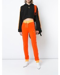 Женские оранжевые спортивные штаны от Fenty X Puma