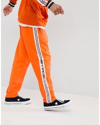 Мужские оранжевые спортивные штаны от Mennace