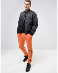 Мужские оранжевые спортивные штаны от Asos