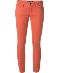 Оранжевые узкие брюки
