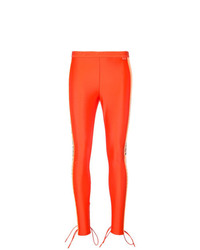 Оранжевые узкие брюки от Fenty X Puma