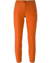 Оранжевые узкие брюки
