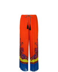 Оранжевые широкие брюки с "огурцами"