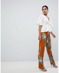 Оранжевые широкие брюки с цветочным принтом от Missguided