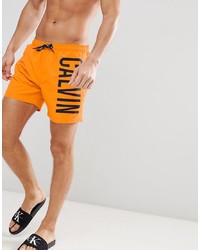 Оранжевые шорты для плавания с принтом от Calvin Klein