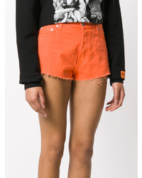 Женские оранжевые шорты от Heron Preston