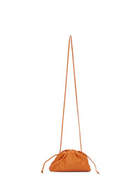 Оранжевый кожаный клатч от Bottega Veneta