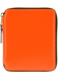 Оранжевый кожаный клатч от Comme des Garcons