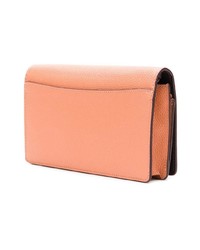 Оранжевый кожаный клатч от Coach