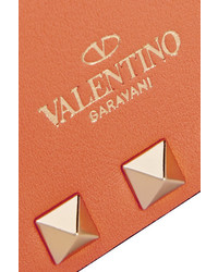 Оранжевый кожаный клатч от Valentino