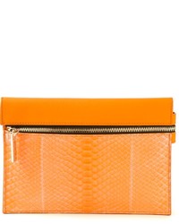 Оранжевый кожаный клатч от Victoria Beckham
