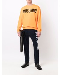 Мужской оранжевый свитшот с принтом от Moschino