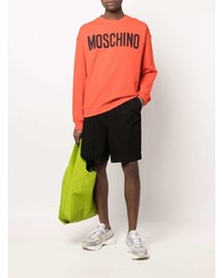 Мужской оранжевый свитшот с принтом от Moschino