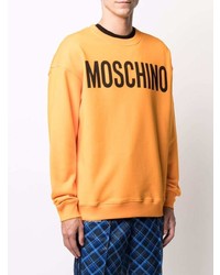Мужской оранжевый свитшот с принтом от Moschino