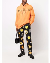 Мужской оранжевый худи с принтом от Moschino