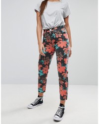 Разноцветные джинсы с цветочным принтом