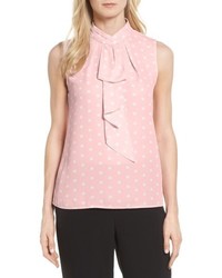 Розовая блузка в горошек