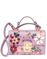 Розовая кожаная сумка через плечо с цветочным принтом
