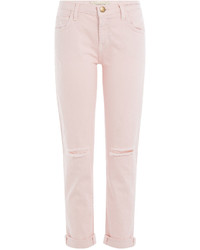 Розовые рваные джинсы