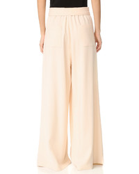 Розовые широкие брюки от Tome